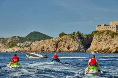 Jet ski rental Dubrovnik — Sea-Doo jet skis passing Fort Lovrijenac with Garitransfer